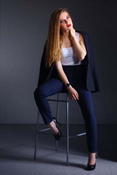 Young woman sitting on a chair - Foto, Imagem