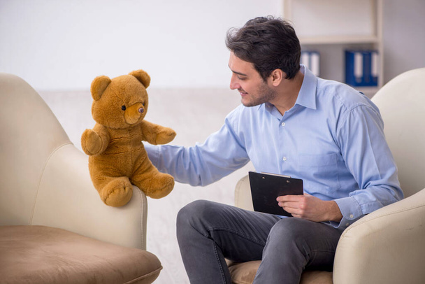 Young psychologist meeting with toy bear - Photo, Image