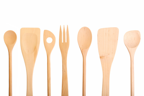 Set of new wooden kitchen utensils (spoons) isolated on white. - Photo, Image
