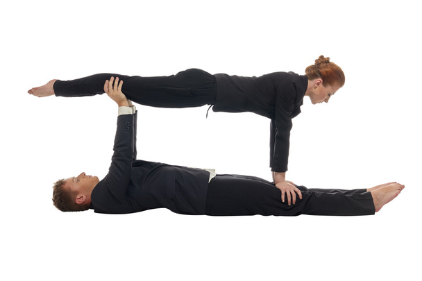 Concept of multitasking. Acrobats keep balance - Фото, зображення