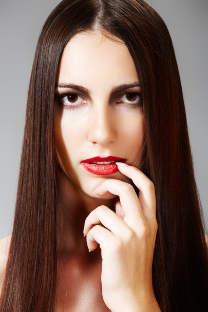 Woman model with red lips. Fashion hairstyle with smooth long female hair - Foto, Bild