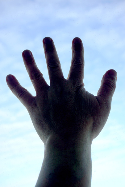 a háttérégbolt emberi kéz - Fotó, kép