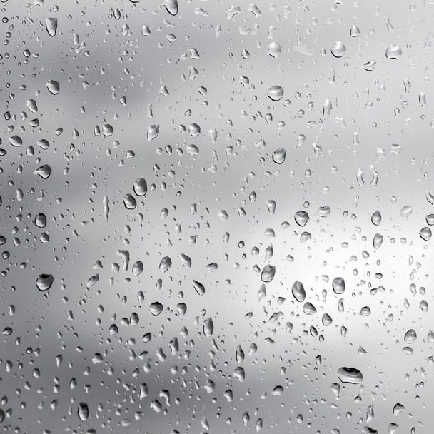 Krople deszczu na szkle okiennym - Zdjęcie, obraz