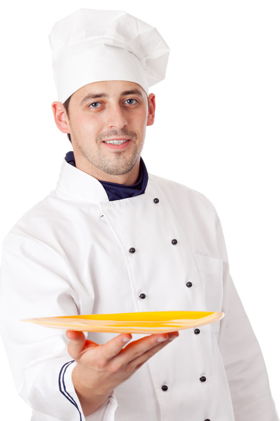 Chef holding plate with something - Фото, зображення
