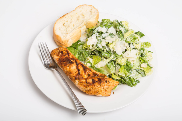 Salmão assado com pão e salada Caesar
 - Foto, Imagem
