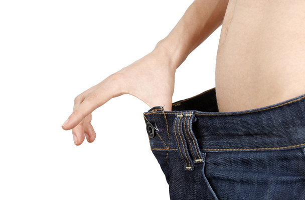 štíhlá žena ve velkých džíny - Fotografie, Obrázek