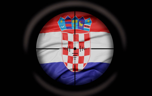 Tarkka-ampuja tähtää kroatialaisen maan suureen värikkääseen lippuun. käsite - Valokuva, kuva