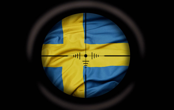 Σκοπευτής σκόπευσης με στόχο τη μεγάλη πολύχρωμη σημαία της Σουηδίας χώρα. έννοια - Φωτογραφία, εικόνα