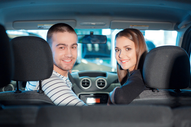 Couple inside the new vehicle in showroom - Photo, Image