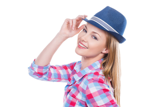 Young woman adjusting her hat - Foto, Bild