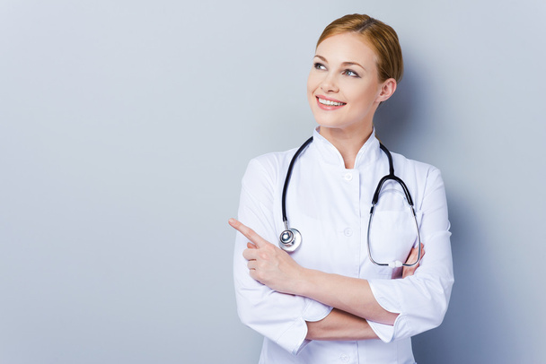Confident female doctor in white uniform - Photo, image