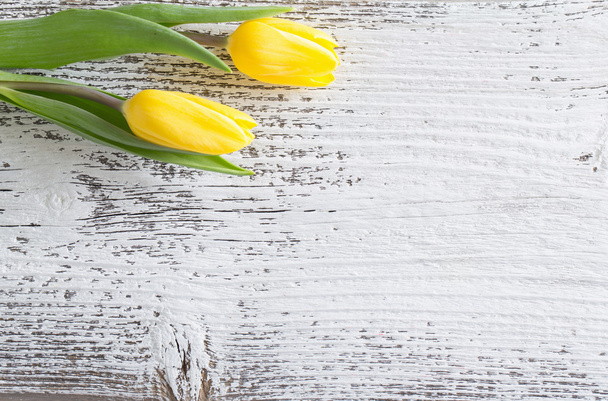 yellow tulips over wooden background - Fotoğraf, Görsel
