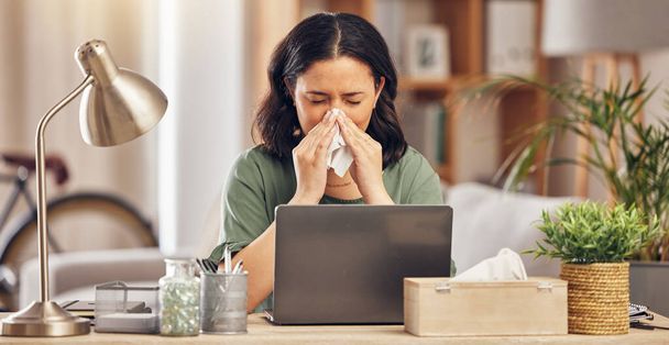 Remote work from home, sneeze and woman with a laptop, virus and illness with disease. Female person, freelancer and entrepreneur blowing her nose, covid and flu with online consultation with doctor. - Photo, Image
