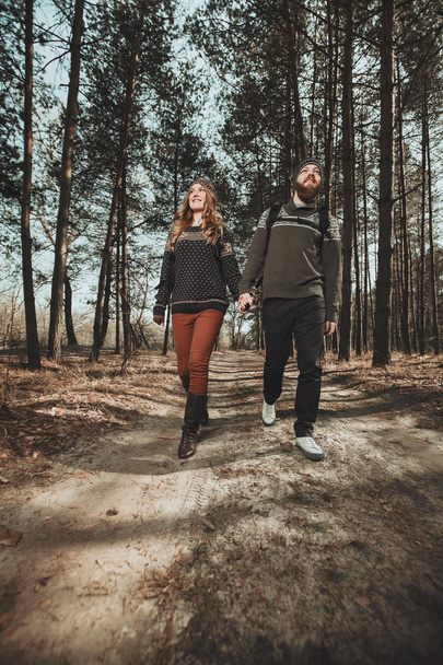 Happy couple walking in the wood - Valokuva, kuva