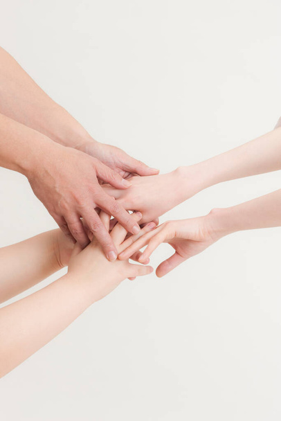 close up of people holding hands on white background. teamwork and unity concept.         - Foto, immagini