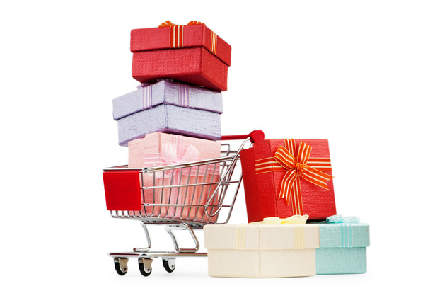Shopping cart and giftboxes on white - Zdjęcie, obraz