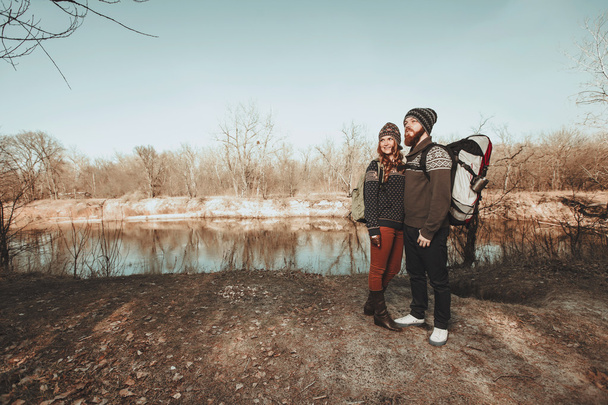 Couple of hikers at the lake shore - Foto, immagini