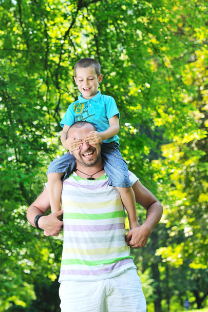 Happy father and son have fun at park - Foto, Bild