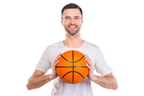 Young man holding basketball ball - Φωτογραφία, εικόνα