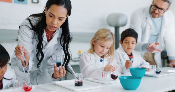 School kids, science and class with teacher, lab and learning information with experiment for knowledge. Children, boy and girl with education, scientist or scholarship for innovation in laboratory. - Photo, Image