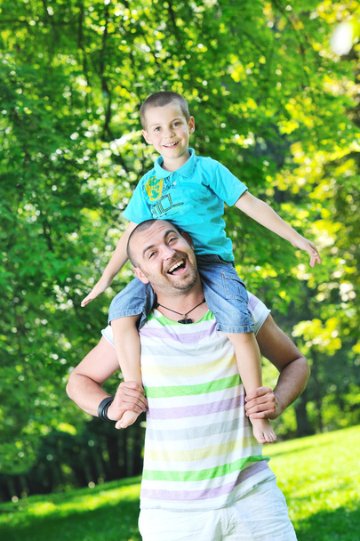 Happy father and son have fun at park - Photo, image