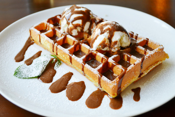 Belgian waffle with ice cream, chocolate and mint - Фото, изображение