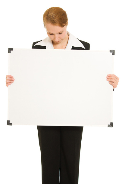 Woman holding a white board. - Zdjęcie, obraz