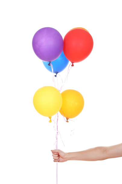 hand with colorful balloons - 写真・画像