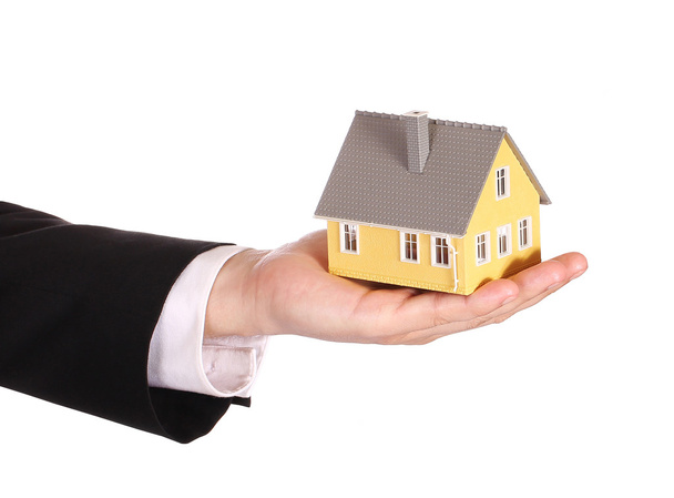 House model in businessman's hand isolated on white. Mortgage - Foto, immagini