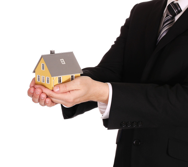House model in businessman's hands isolated on white. Mortgage - Foto, immagini