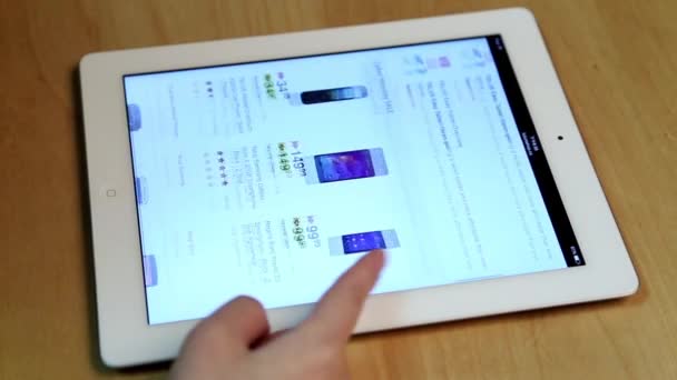 Woman shopping new cellphone of Futureshop website on ipad display - Footage, Video