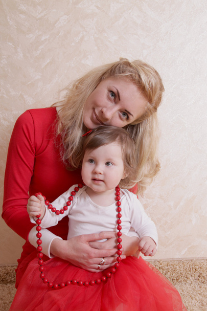 Mother and baby with beads - Photo, image