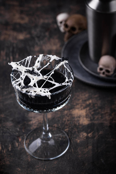 Halloween cocktail black martini with spider cobweb - Photo, Image