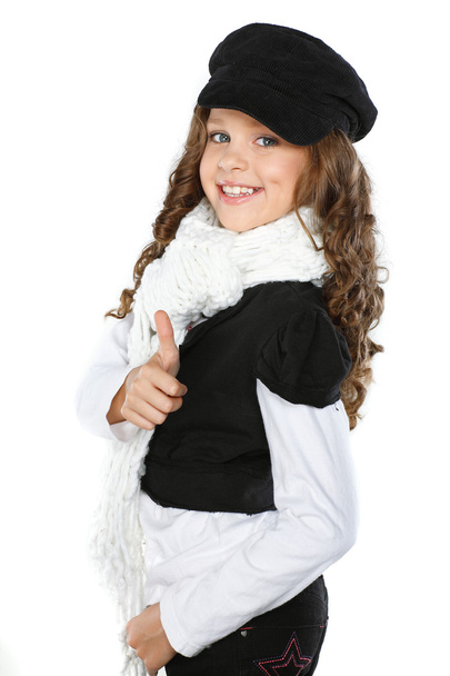 A little beautiful girl is in autumn clothes, isolated on a white backgroun - Фото, изображение