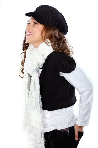 A little beautiful girl is in autumn clothes, isolated on a white backgroun - Zdjęcie, obraz
