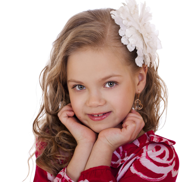 Portrait of a charming little girl looking at camera - Foto, Imagen