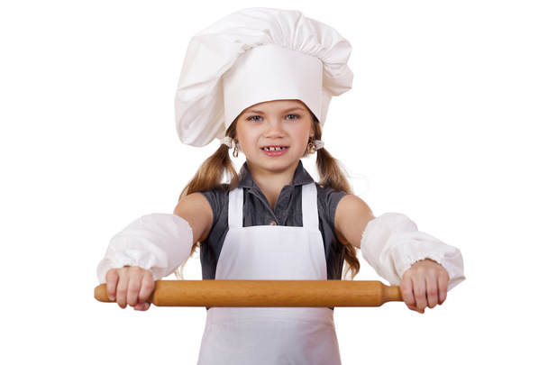 Cute little girl baking on kitchen and shows rolling-pin, isolated on a white background - Fotoğraf, Görsel