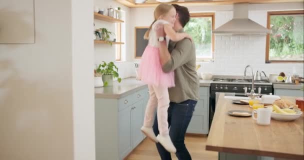 Single parent, happy and father hug child and bonding in a kitchen together and excited for a meal or food. Tutu, Celebrate and dad with energy enjoy quality time with kid as love, care and happiness. - Footage, Video