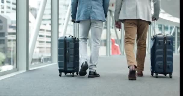 Travel luggage, business people and legs at airport with suitcase and bag for work and holiday. Walking, group and traveler with job commute and corporate professional in lobby with vacation baggage. - Footage, Video