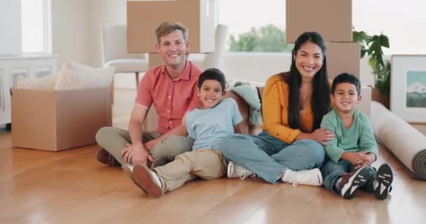 Happy family, real estate and moving in new home for mortgage loan, investment or property together. Portrait of father, mother and children smile with boxes in renovation or relocation for house. - Footage, Video