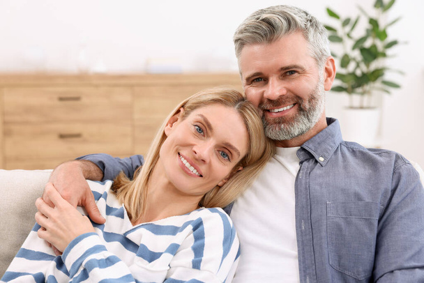 Portrait of happy affectionate couple at home. Romantic date - Photo, image