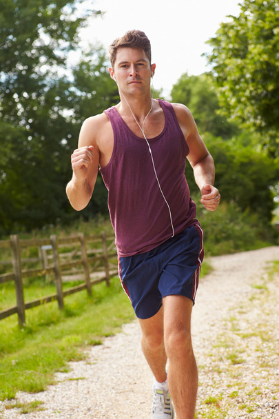 Man Running and Wearing Earphones - Photo, Image