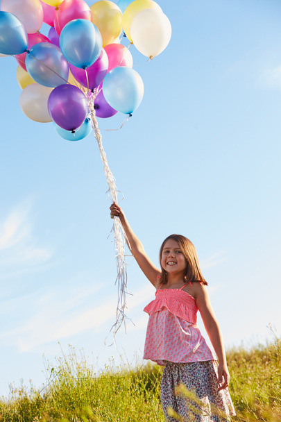 Young Girl Holding  Balloons - Фото, изображение