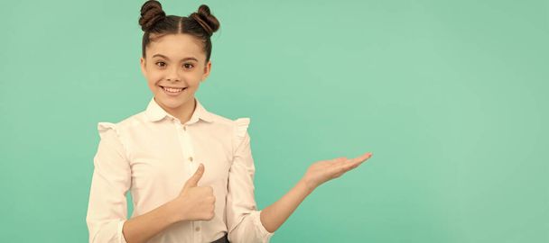 Happy primary school girl give thumbs up showing open hand gesture back to school sale, shopping. Child face, horizontal poster, teenager girl isolated portrait, banner with copy space - Photo, Image