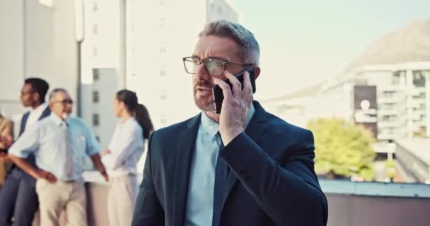 Smile, talking and businessman on a phone call at work for networking or communication. Happy, ceo and an executive mature employee or manager speaking on a mobile at the office for discussion. - Footage, Video