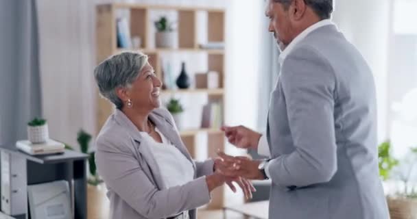 Happy, senior couple dancing and in a modern office of their workplace together. Romantic love or retirement, happiness or bonding time and married people dance with music at their workspace - Footage, Video