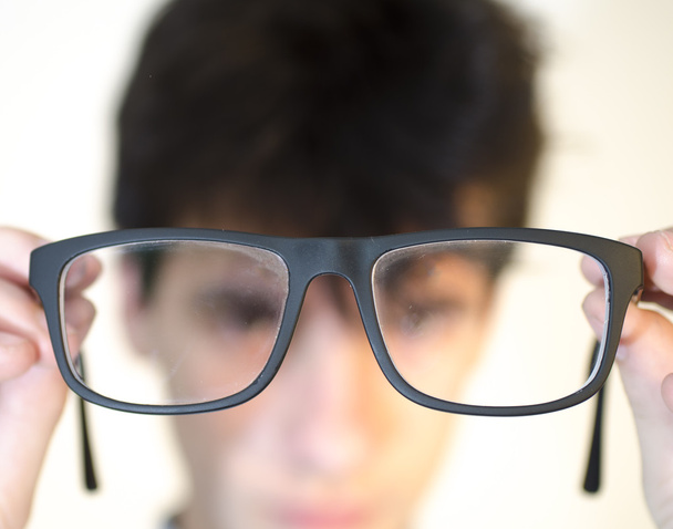 Eyeglasees near eyes - Photo, Image