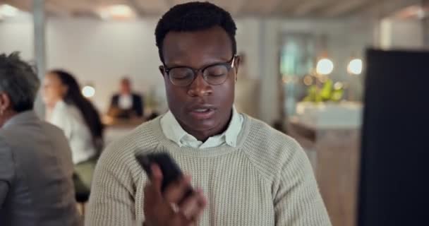 Cellphone, computer and black man in office, negotiation and conversation with sales advice. Phone call, lead generation and consultant with networking, deal info and advisory business discussion - Footage, Video