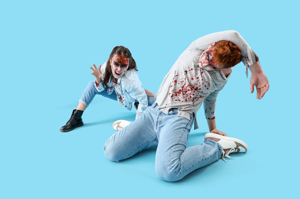 Scary zombies on blue background - Photo, Image