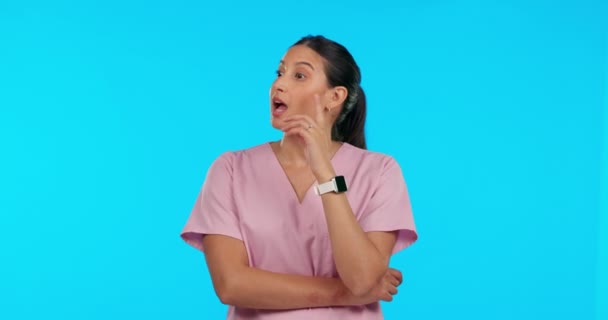 Thinking, talking and a doctor or woman with ideas isolated on a mockup blue background in studio. Medical planning, speaking and a nurse in conversation for a plan or idea with space for nursing. - Footage, Video